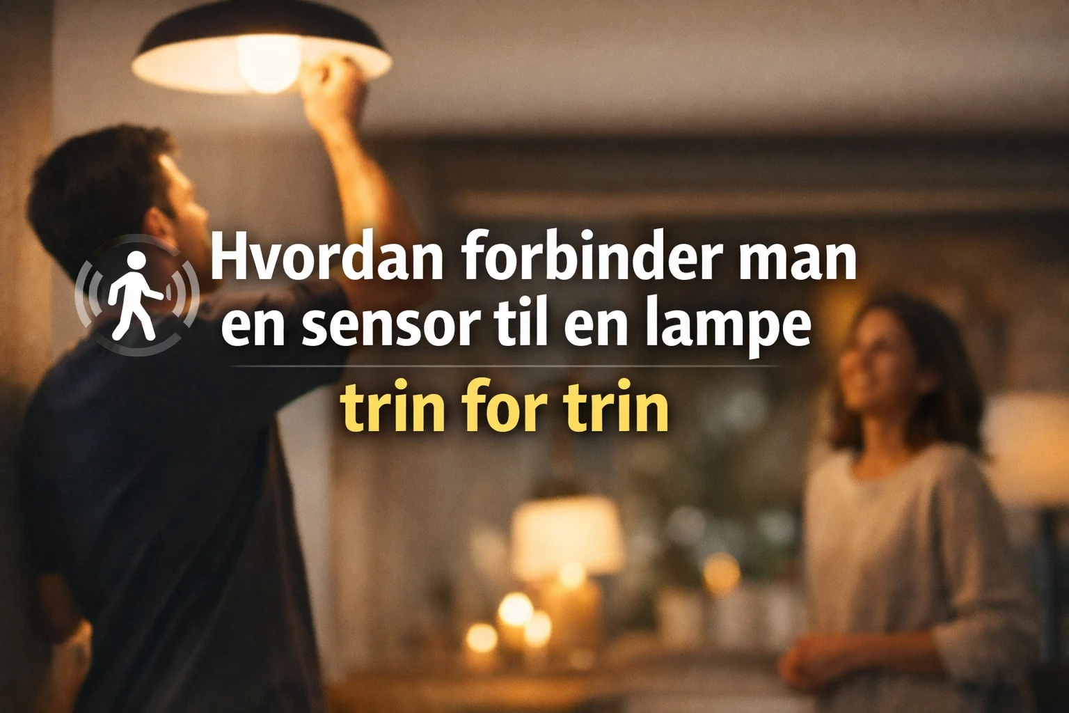 billedet viser en mand i gang med at sætte en lampe op og omhandler spørgsmålet hvordan forbinder man en sensor til en lampe